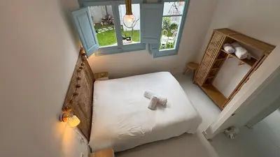 Cama o camas de una habitación en Casa con vistas al mar y jardín