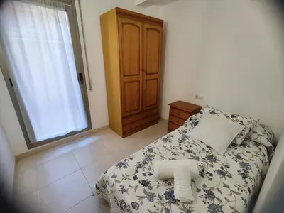 Cama o camas de una habitación en Apartamento con vistas al mar y parking