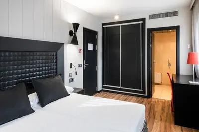 Cama o camas de una habitación en Salles Hotel Aeroport de Girona