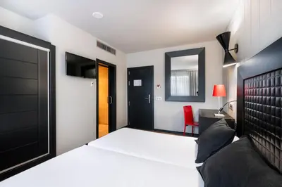 Cama o camas de una habitación en Salles Hotel Aeroport de Girona