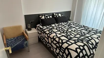 Cama o camas de una habitación en Blanes a pie de playa s'abanell