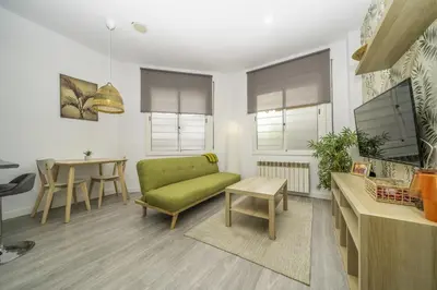 Una televisión o centro de entretenimiento en HomeHolidaysRentals Balmes - Costa Barcelona