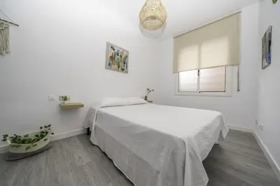 Cama o camas de una habitación en HomeHolidaysRentals Balmes - Costa Barcelona