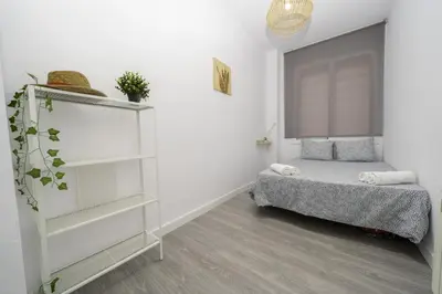 Cama o camas de una habitación en HomeHolidaysRentals Balmes - Costa Barcelona
