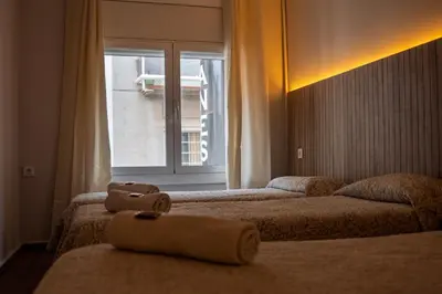 Cama o camas de una habitación en CozyCatalonia - Suite Apartment at Can Setmanes Central Blanes