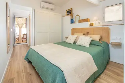 Cama o camas de una habitación en Casa con encanto a pie de playa