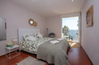 Cama o camas de una habitación en BEACH APARTMENT San Jorge