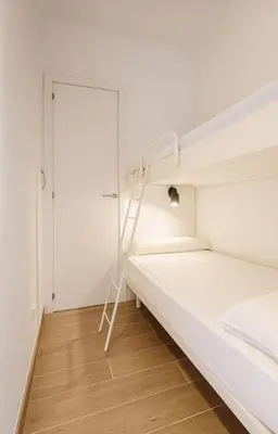 Cama o camas de una habitación en Apartamento con Jardín a 30 segundos de la playa