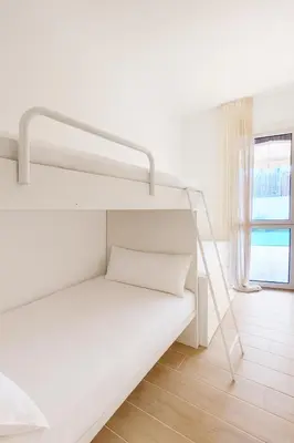 Cama o camas de una habitación en Apartamento con Jardín a 30 segundos de la playa