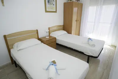 Cama o camas de una habitación en HomeHolidaysRentals Olai - Costa Barcelona