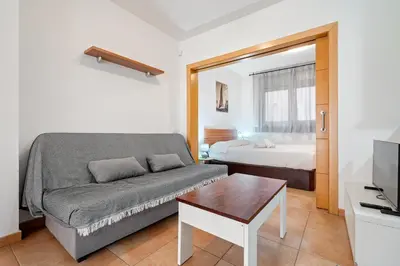 Cama o camas de una habitación en Hauzify I Apartaments Bellaire