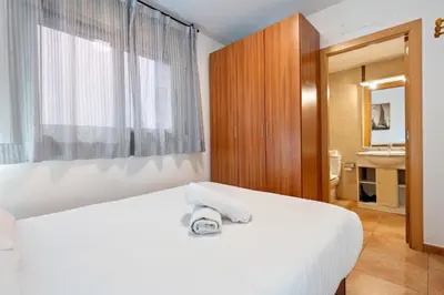 Cama o camas de una habitación en Hauzify I Apartaments Bellaire
