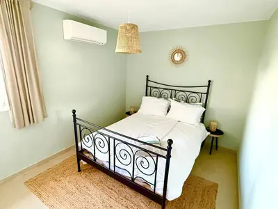 Cama o camas de una habitación en Hauzify I Apartament Grumet