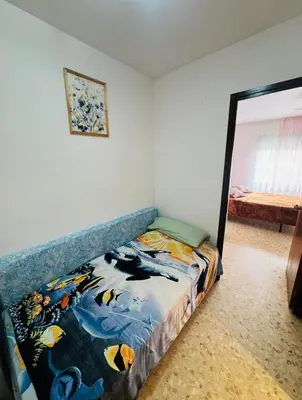 Cama o camas de una habitación en Confortable piso con 2 piscinas cerca de la playa