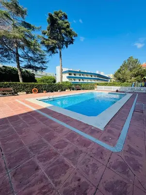 Piscina en o cerca de Confortable piso con 2 piscinas cerca de la playa
