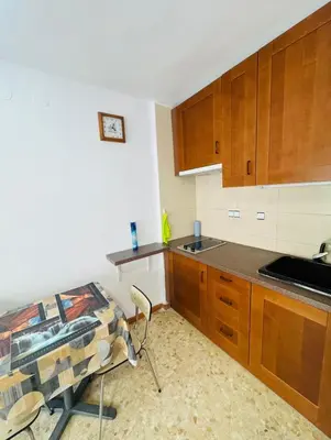 Una cocina o zona de cocina en Confortable piso con 2 piscinas cerca de la playa