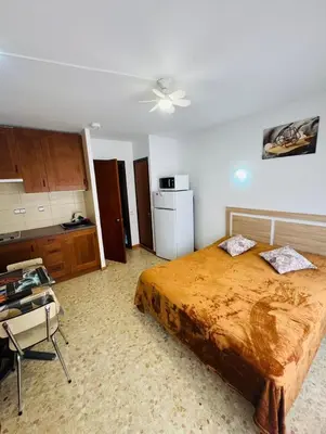 Cama o camas de una habitación en Confortable piso con 2 piscinas cerca de la playa