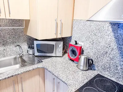 Una cocina o zona de cocina en Joy Apartments