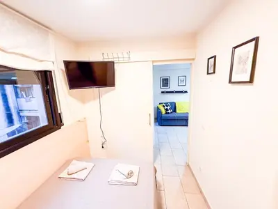 Una televisión o centro de entretenimiento en Ideal Aparmennts
