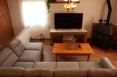 Una televisión o centro de entretenimiento en Apartamento Can Jaramills 2