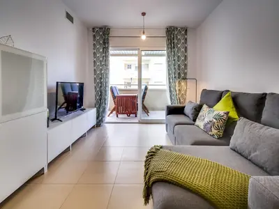 Una televisión o centro de entretenimiento en Apartment in Fenals near Stunning Beaches