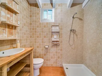 Un baño de Villa in Palafolls with Private Pool & BBQ