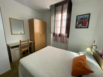 Cama o camas de una habitación en Pensión Borràs