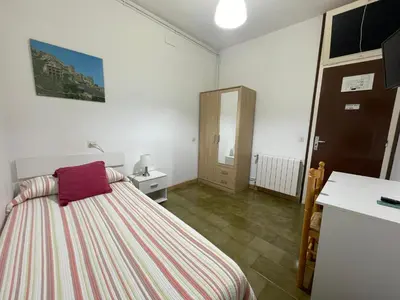 Cama o camas de una habitación en Pensión Borràs