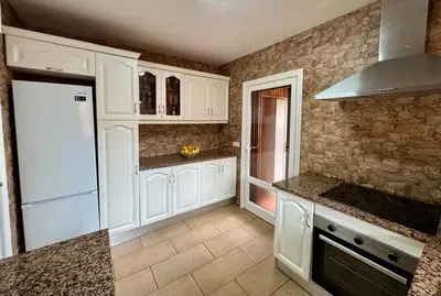 Una cocina o zona de cocina en Villa Paraiso - mit riesigem Traumpool