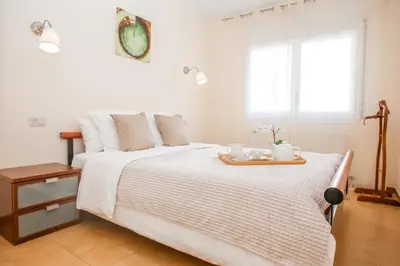 Cama o camas de una habitación en AL50 Apartamento playa Fenals