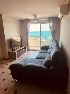 Zona de estar de Apartamento en 1ª línea con vistas al mar cerca de Barcelona