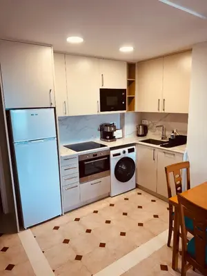 Una cocina o zona de cocina en Apartamento en 1ª línea con vistas al mar cerca de Barcelona