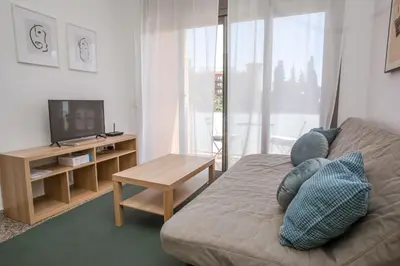 Una televisión o centro de entretenimiento en AL45 - Apartamento en segunda línea de mar Fenals
