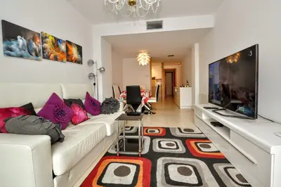 Una televisión o centro de entretenimiento en Apartment Verano Go2lloret