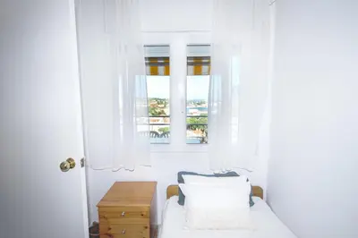 Cama o camas de una habitación en Apto con vista fantástica y piscina en S'Agaró