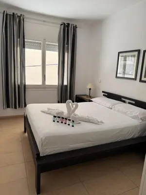 Cama o camas de una habitación en Apartamento Pineda de Mar con Vistas al Mar