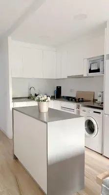 Una cocina o zona de cocina en MEDITERRANEAN APt