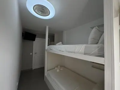 Cama o camas de una habitación en Apartamentos en la rambla