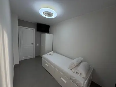 Cama o camas de una habitación en Apartamentos en la rambla