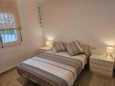 Cama o camas de una habitación en El PI Apartamento con jardín a 2 minutos playa y 2 minutos centro