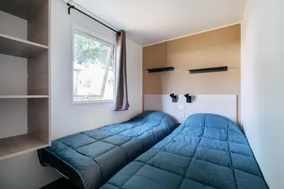 Cama o camas de una habitación en Camping Alannia El Pinar