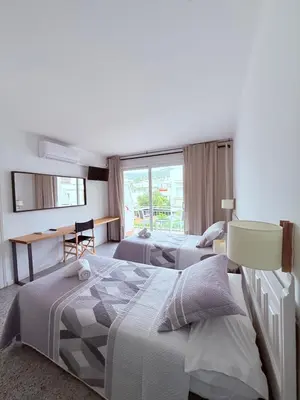 Cama o camas de una habitación en L'Illa Hotel