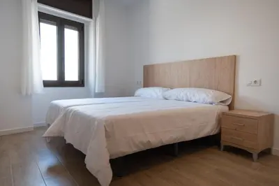 Cama o camas de una habitación en LETS HOLIDAYS Centric & Near the Sea Victoria apartment 3
