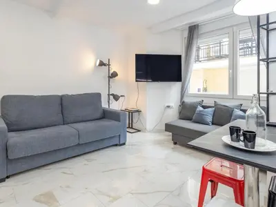 Una televisión o centro de entretenimiento en Winahost Apartamento Blanes