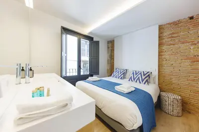 Cama o camas de una habitación en Bravissimo Ballesteries Onyar View, Monthly Apartment