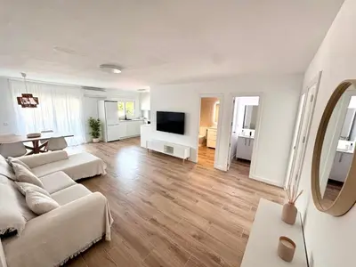 Una televisión o centro de entretenimiento en Apartamento Platja d 'Aro 70 m2