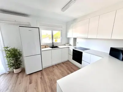 Una cocina o zona de cocina en Apartamento Platja d 'Aro 70 m2