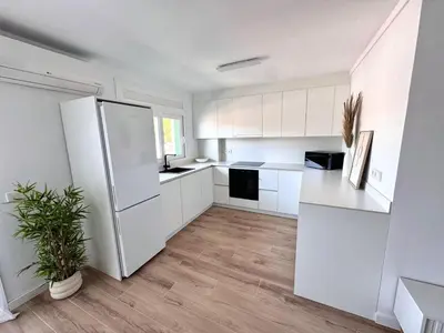 Una cocina o zona de cocina en Apartamento Platja d 'Aro 70 m2