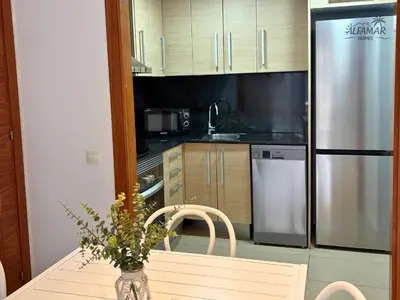 Una cocina o zona de cocina en Nagomi Suite - Modern Apartment with Parking & Swimming Pool