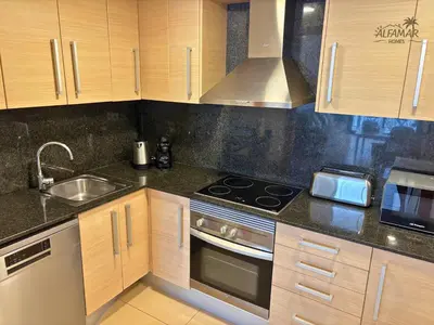 Una cocina o zona de cocina en Kioto Suite - Modern Apartment with Parking & Swimming Pool